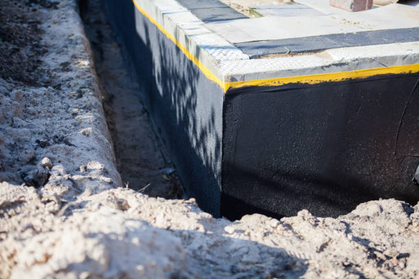 Professional Basement Waterproofing technician working in Knoxville, MD